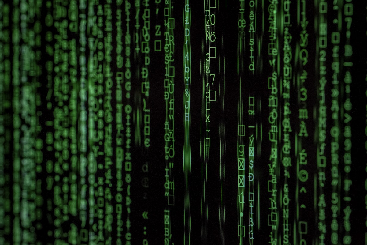 Streams of code and data on a dark screen