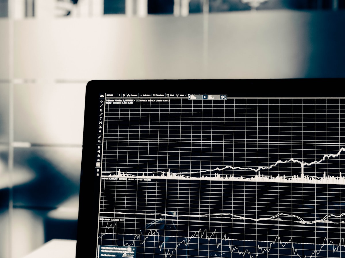 Software developer writing code on a laptop