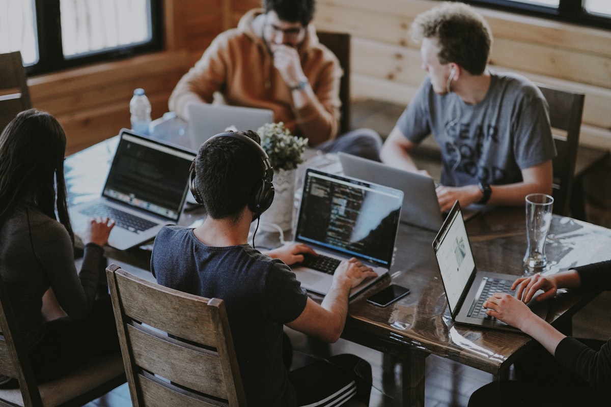 Software team collaborating around a table